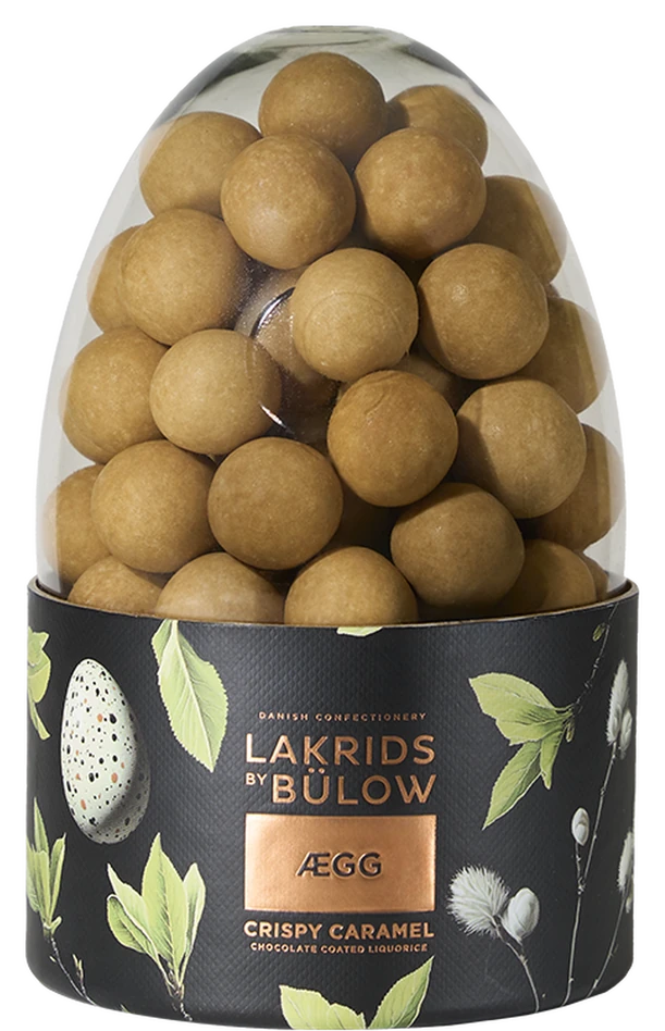 Lakrids by Bülow CRISPY CARAMEL ÆGG – egg-shaped licorice candies with caramel and sugar glaze in packaging