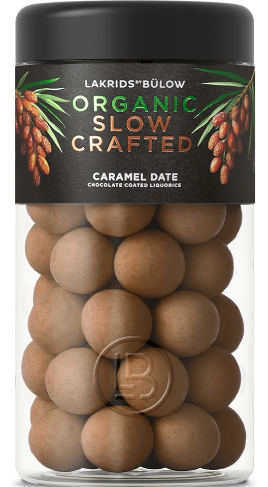 Lakrids by Bülow CARAMEL DATE – black tin with gold design, filled with glazed licorice caramel date balls