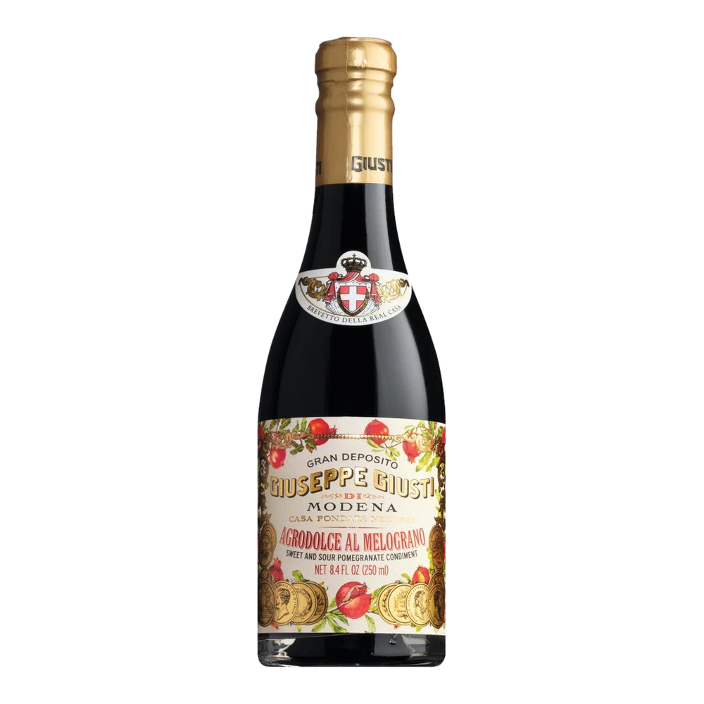 Acetaia Giusti Agrodolce al Melograno, italienischer Würzessig mit Granatapfelsaft und Weinessig, in einer Glasflasche.