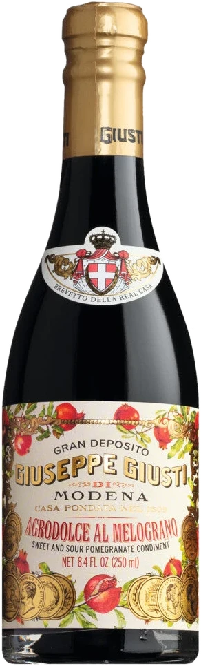 Acetaia Giusti Agrodolce al Melograno, italienischer Würzessig mit Granatapfelsaft und Weinessig, in einer Glasflasche.