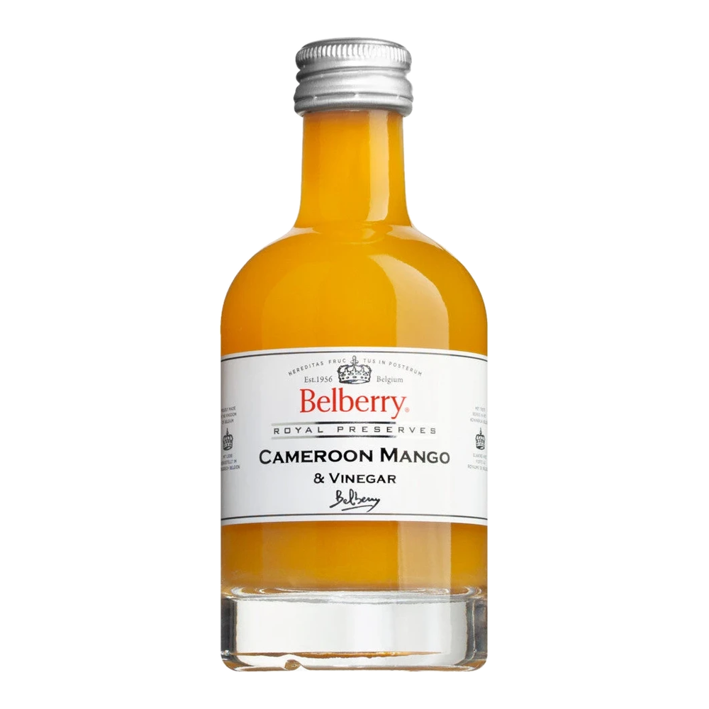 Glass bottle of Cameroon Mango Vinegar, a fruit vinegar made from Cameroon mangoes with a tropical aroma.