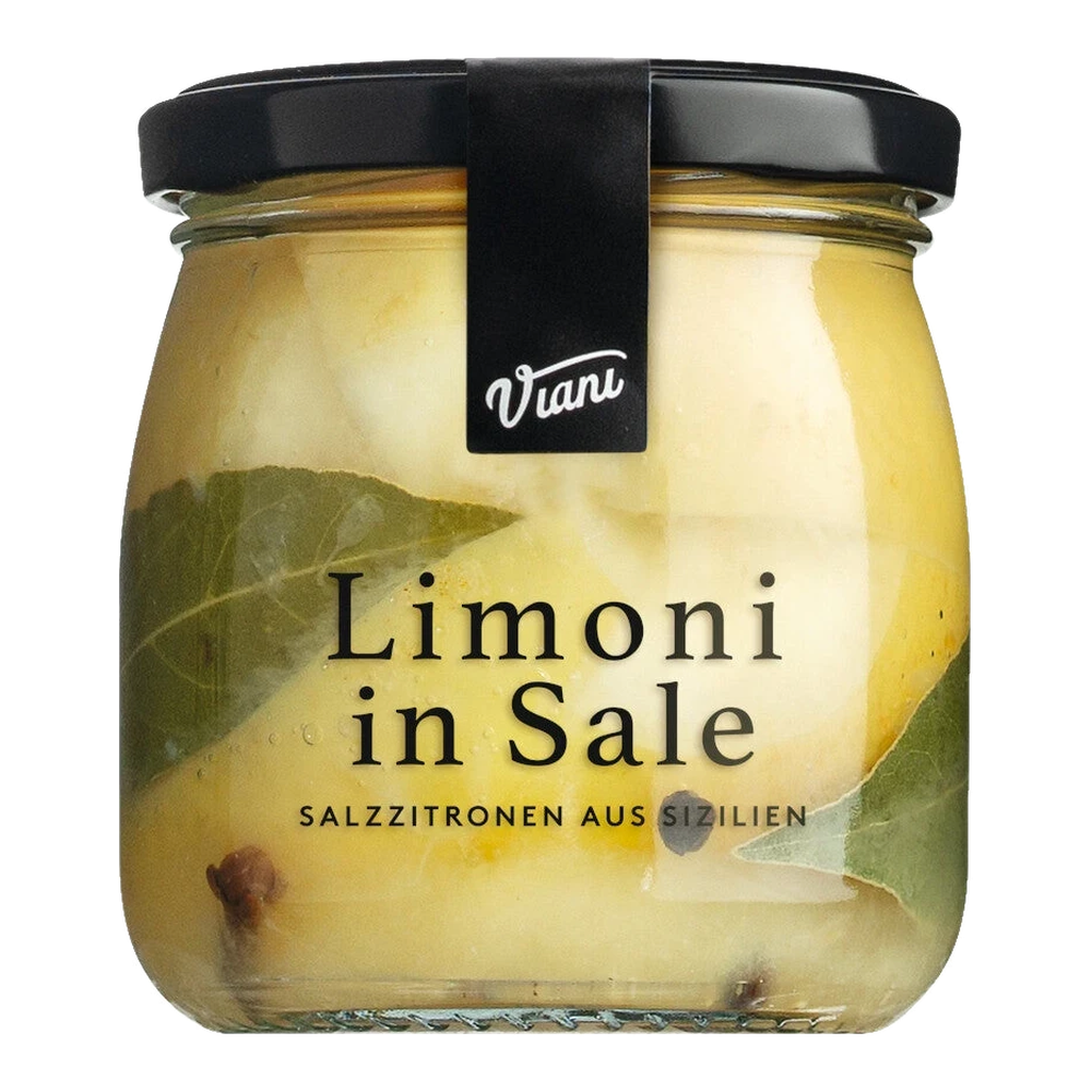 Jar with Sicilian salt lemons, preserved with bay leaves, cloves, and pepper — Limoni in sale, antipasti