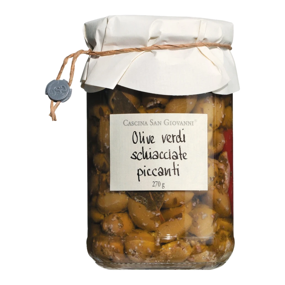Green, crushed olives with chili and herbs in extra virgin olive oil – Olive verdi schiacciate piccanti, antipasto in a jar