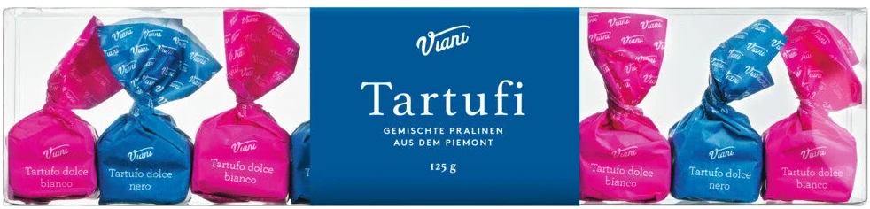 Neun Schokoladentrüffel im Etui — vier weiße, fünf dunkle, gefüllt mit Ganache und Piemont-Haselnüssen.
